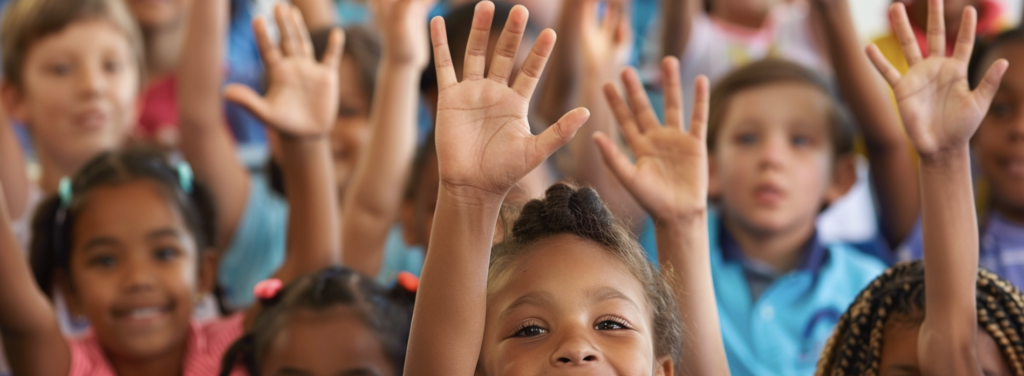 students raising their hands